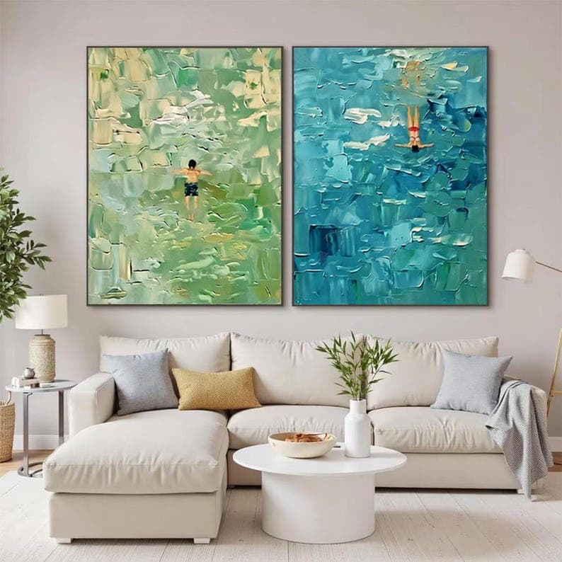 Coordinated pair of large hand-painted artworks above sectional seating.