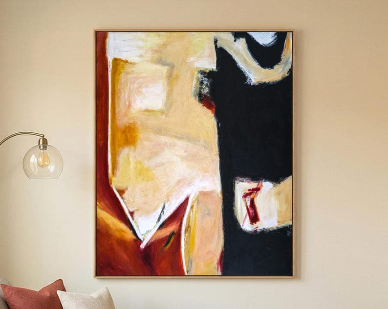Large vertical black, cream and rust abstract painting displayed above a sofa.